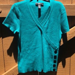 Green sweater top with black buttons